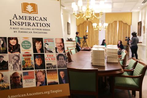 American Inspiration poster and stacks of programs at Gail Collins event