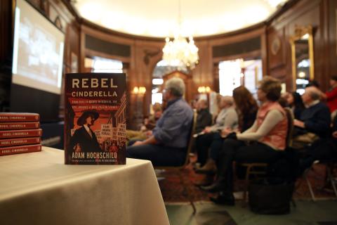Book cover and crowd at Adam Hochschild Rebel Cinderella event