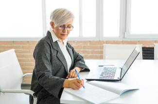 event-using-word-write-family-history-1-2022.jpg Woman Writing While on Laptop