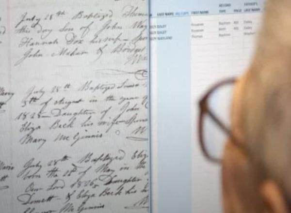Person with glasses looking at documents